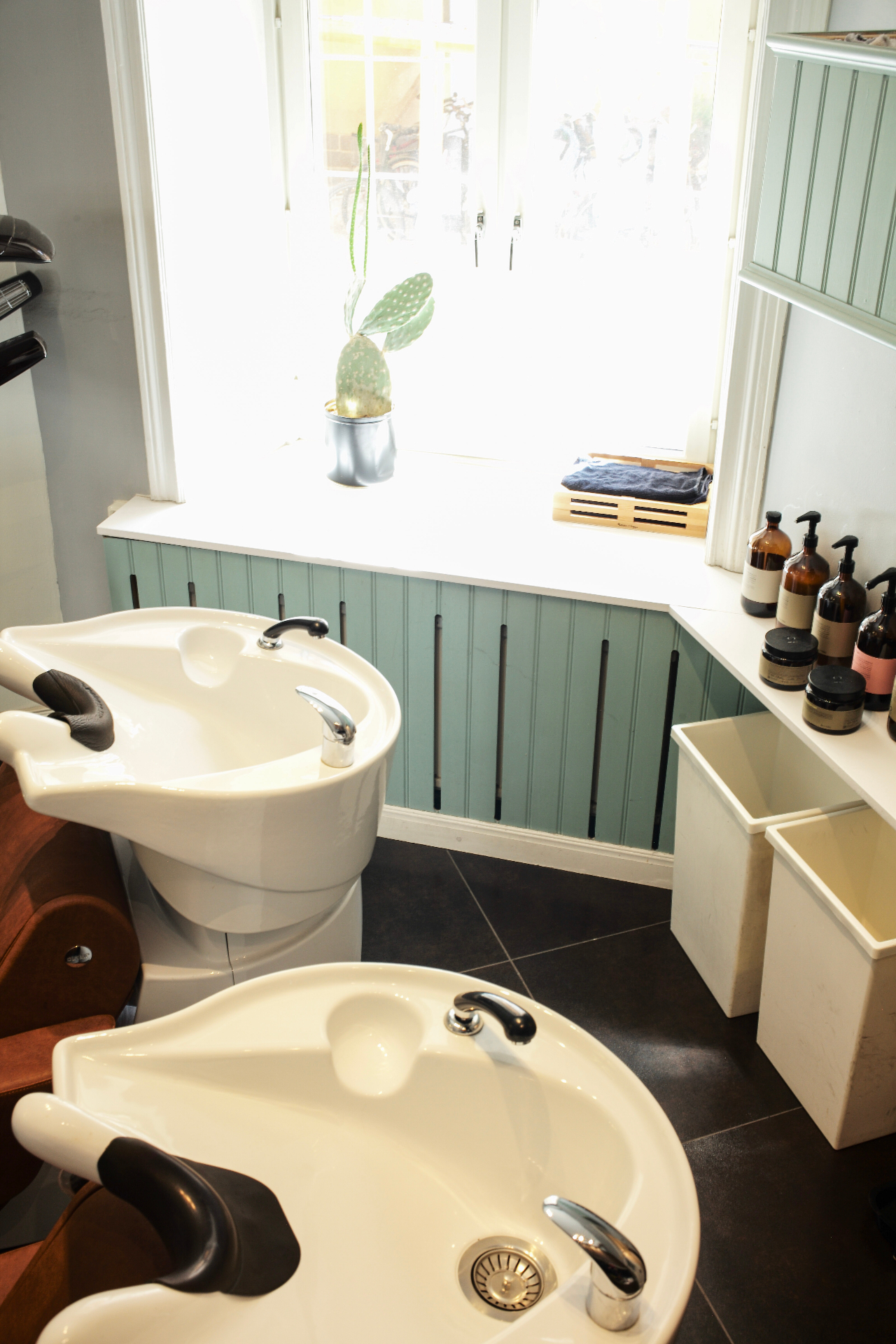 Wash basins by the sunlit window
